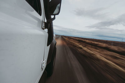 Scenic view of sky seen through car window