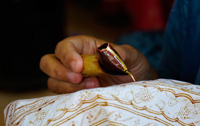 Close-up of person preparing food