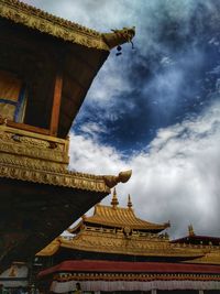 Low angle view of temple against cloudy sky