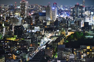 High angle view of illuminated buildings in city