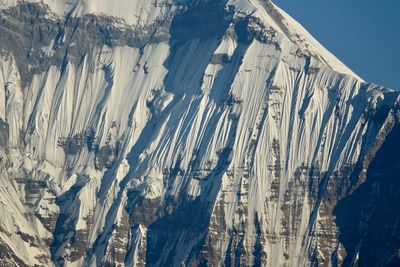 Panoramic shot of icicles on mountain against sky