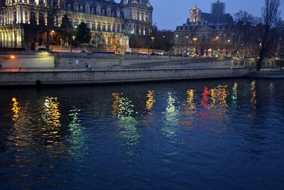 Reflection of illuminated buildings in water at night