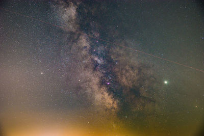 Low angle view of stars in sky at night