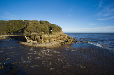 Headland in scarborough which is reached via a footbridge over the scalby beck