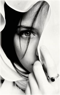 Close-up portrait of woman wearing hat