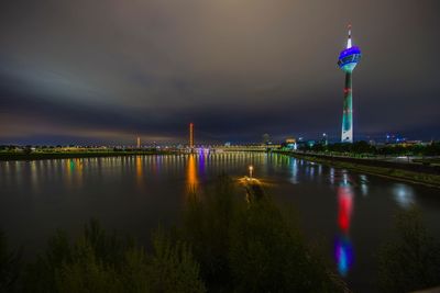 Illuminated city at waterfront