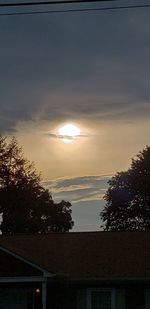 Silhouette trees against sky during sunset