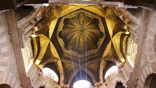 Low angle view of ornate ceiling of historic building