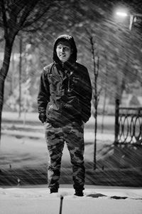 Portrait of man standing in snow