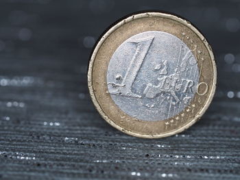 Close-up of coins on table