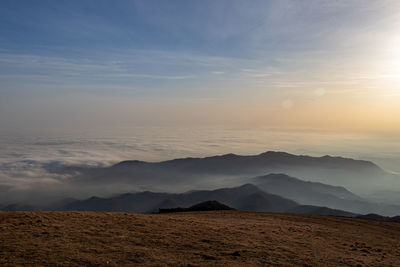 Panoramic view of fog on the hills from mountain