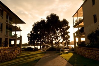 Buildings against cloudy sky