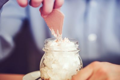 Midsection of person holding ice cream