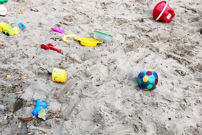 High angle view of toys on beach