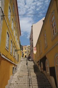 Street amidst buildings against sky