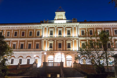 Low angle view of building against sky at night