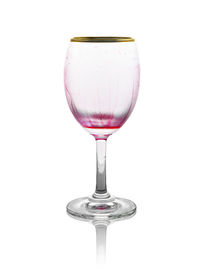 Close-up of wineglass against white background
