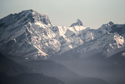 Scenic view of snowcapped mountains against sky