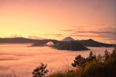 Scenic view of mountains against sky during sunrise