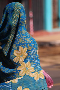 Close-up of woman wearing flower