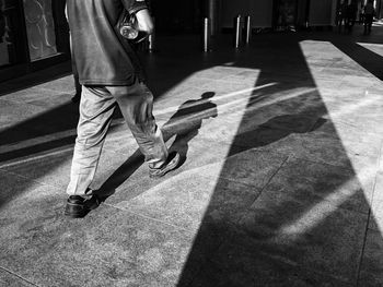 Low section of people walking on road