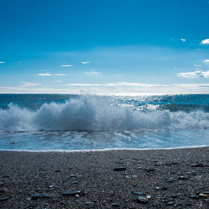 Scenic view of sea against blue sky