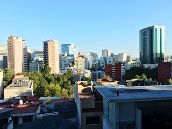 Modern buildings against clear sky