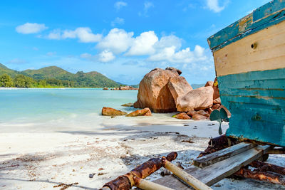 Idyllic tropical exotic landscape on sandy beach, old boat, summer, sea.