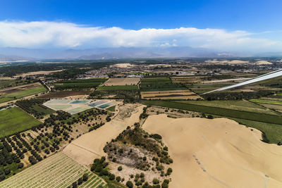 Aerial view of agricultural field against sky