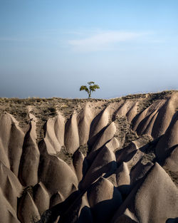 Scenic view of rocks on land against sky