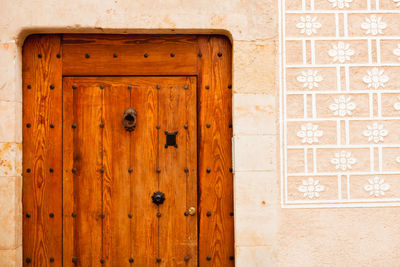 Close-up of closed door of old building