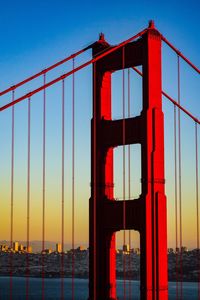View of suspension bridge against sky during sunset