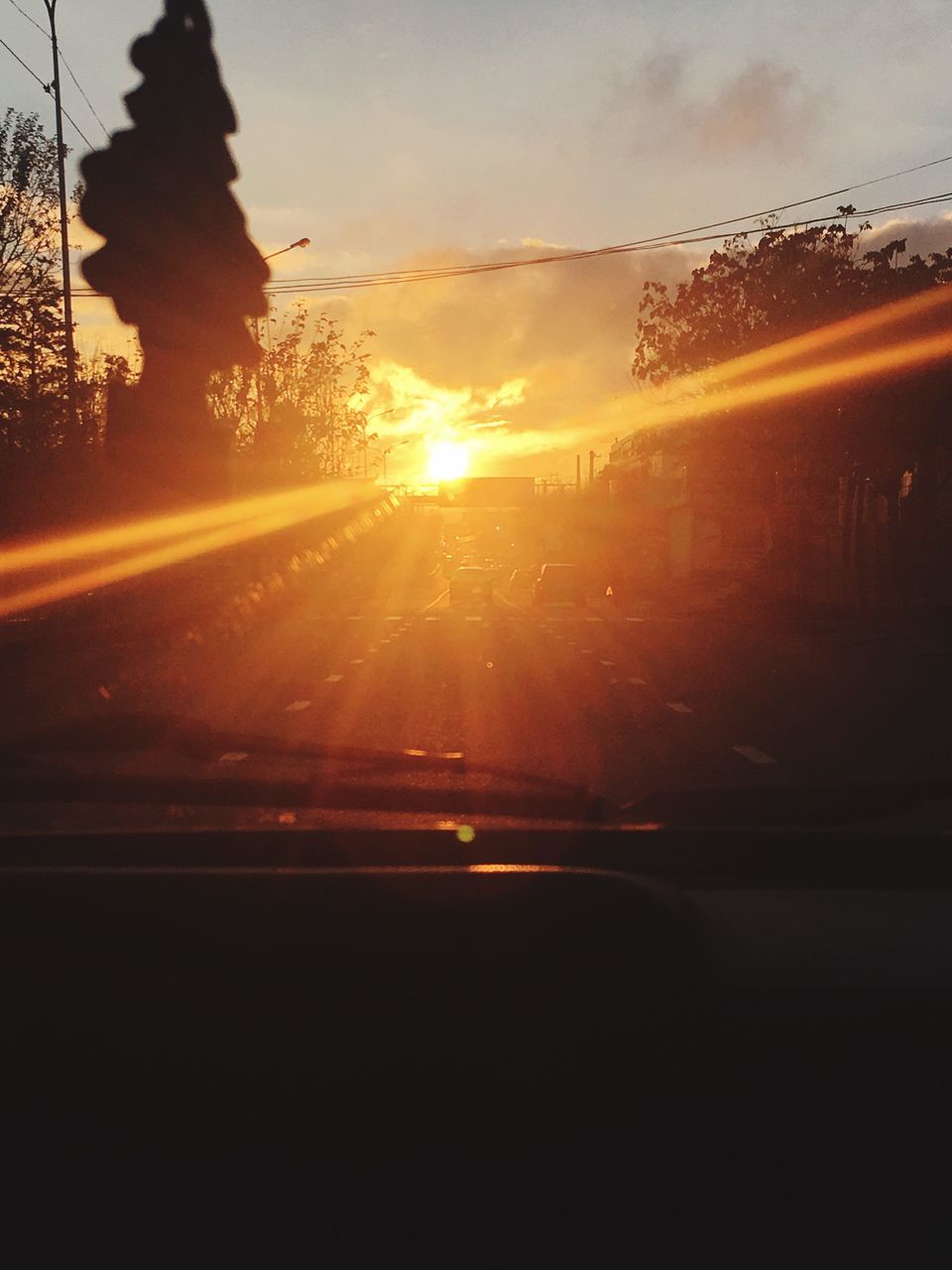 sunset, car, transportation, land vehicle, mode of transport, vehicle interior, car interior, sky, road, travel, no people, sun, sunbeam, windscreen, nature, close-up, beauty in nature, outdoors, water, day