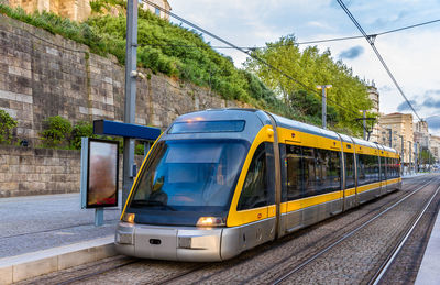 Train on railroad track in city