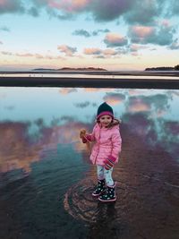 Portrait of girl standing on shore