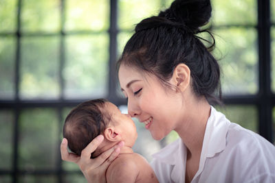 Portrait of mother and daughter outdoors