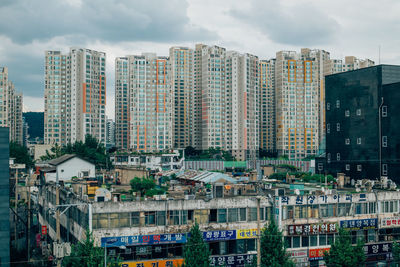 High angle view of buildings in city against sky