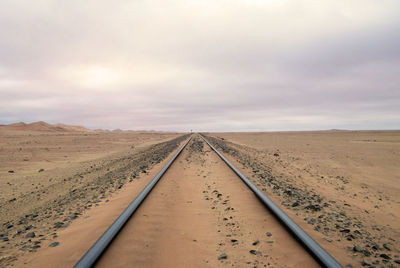 Railroad track against sky