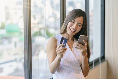 Young woman using mobile phone