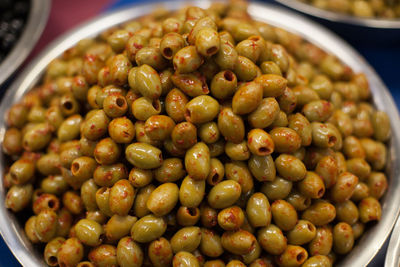 Close-up of olives in container on table