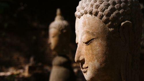 Close-up of weathered buddha statue