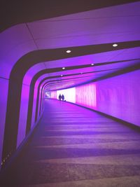 Woman walking in tunnel