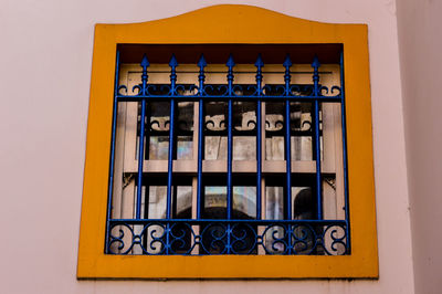 Low angle view of window on building wall