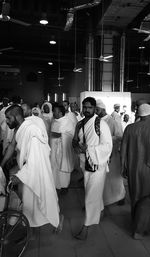 Rear view of people standing in temple