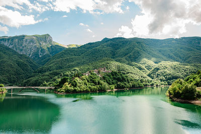 Panoramic view of lake and mountains against sky