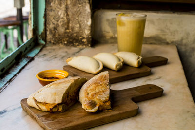 High angle view of bread on cutting board