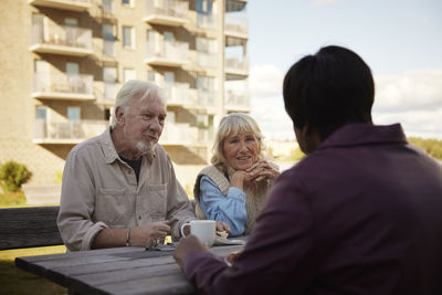 People having coffee together