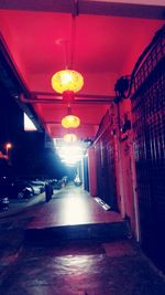 Empty illuminated corridor of building