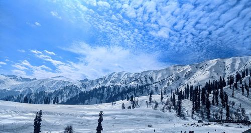 Scenic view of snowcapped mountains against sky