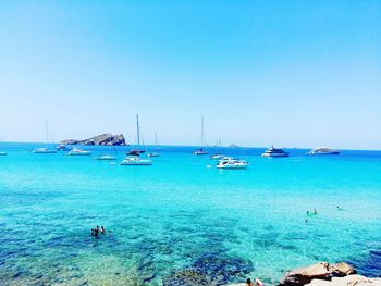 Boats moored in sea